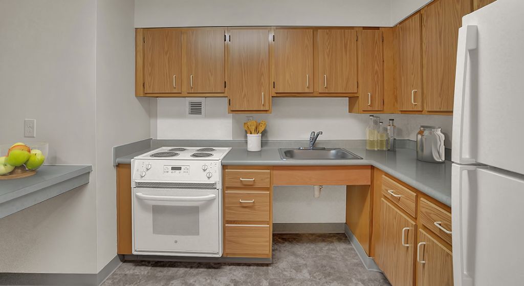 Interior kitchen space with cabinets and appliances.