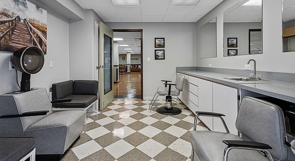 Hair salon area with chairs and mirrors
