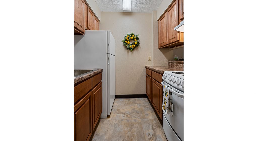 Kitchen area with cabinetry and appliances