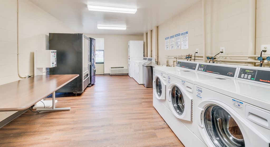 Laundry room with washing machines and dryers
