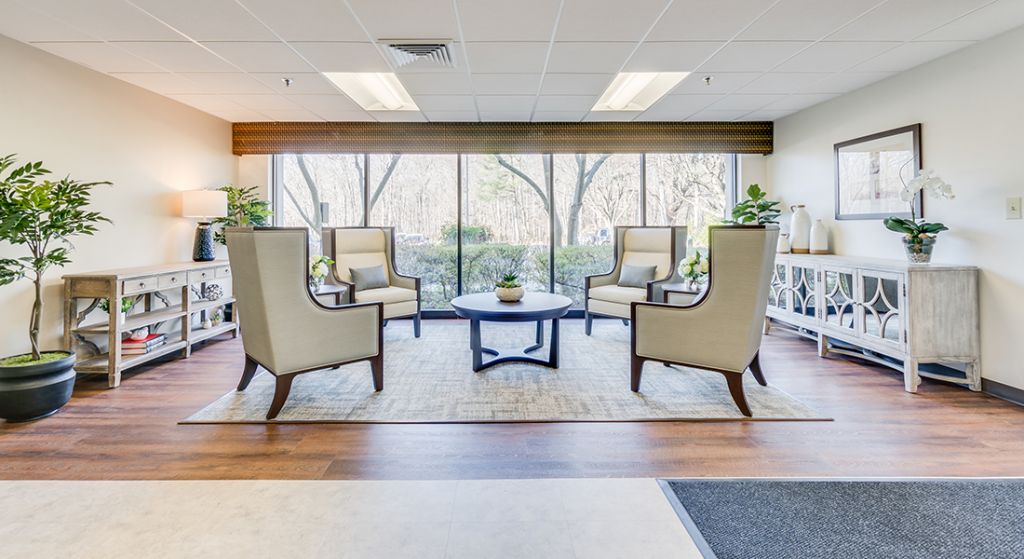 Cozy lounge area with comfortable seating and natural light.