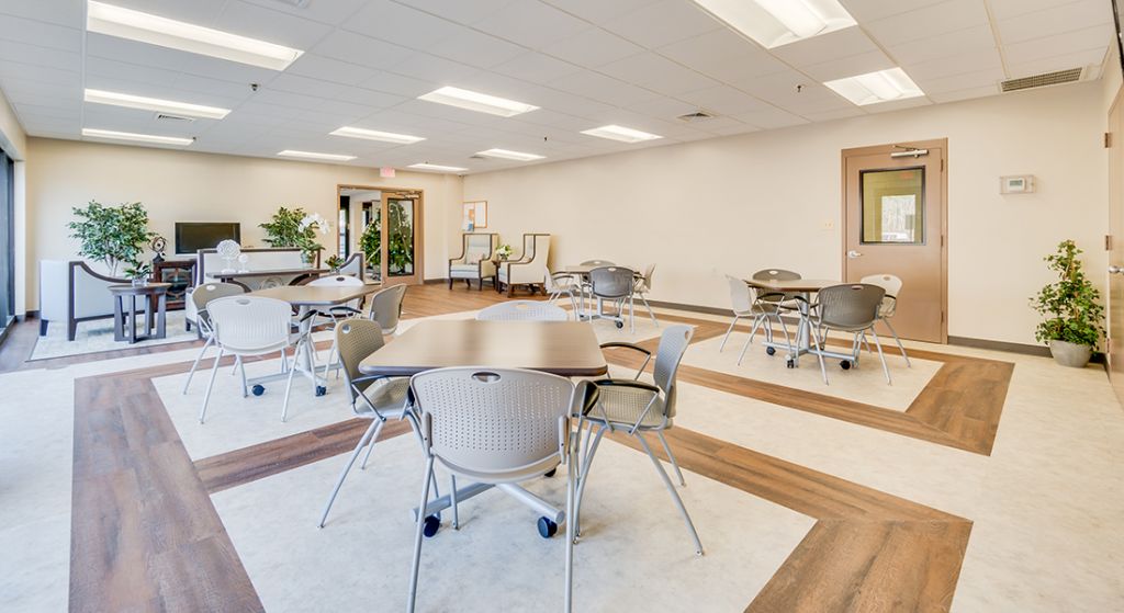 Spacious common area with seating and tables