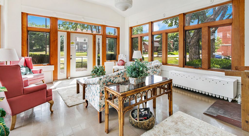 Bright common area with comfortable seating and large windows.