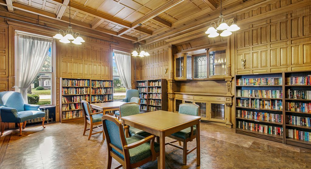 Cozy library with bookshelves and tables