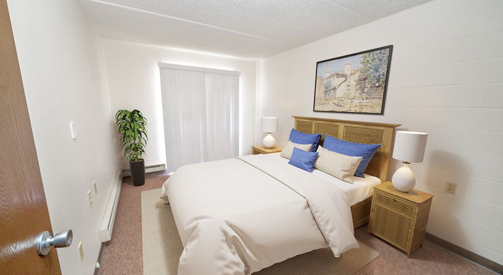 Cozy bedroom setup with light decor and furnishings.