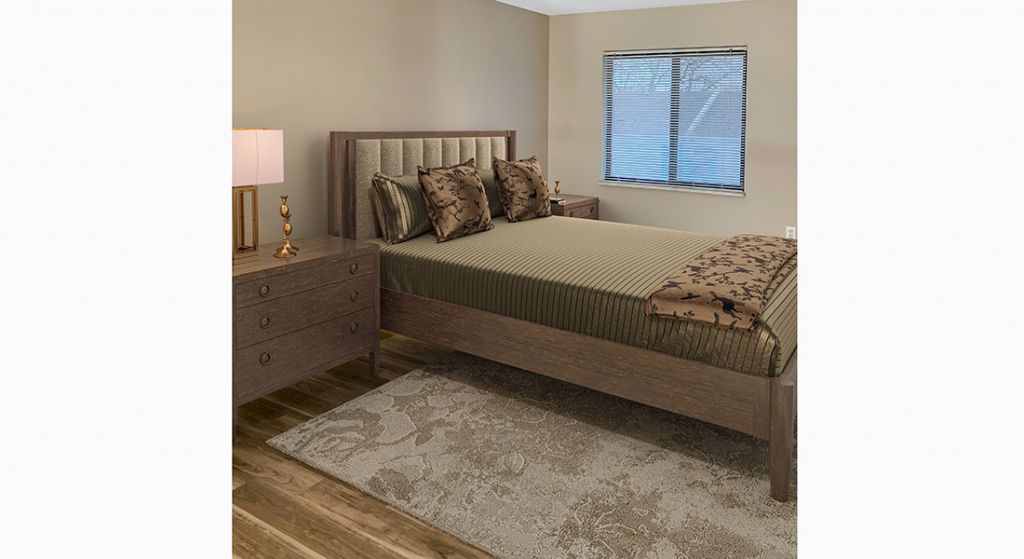 Well-furnished private bedroom with natural light.