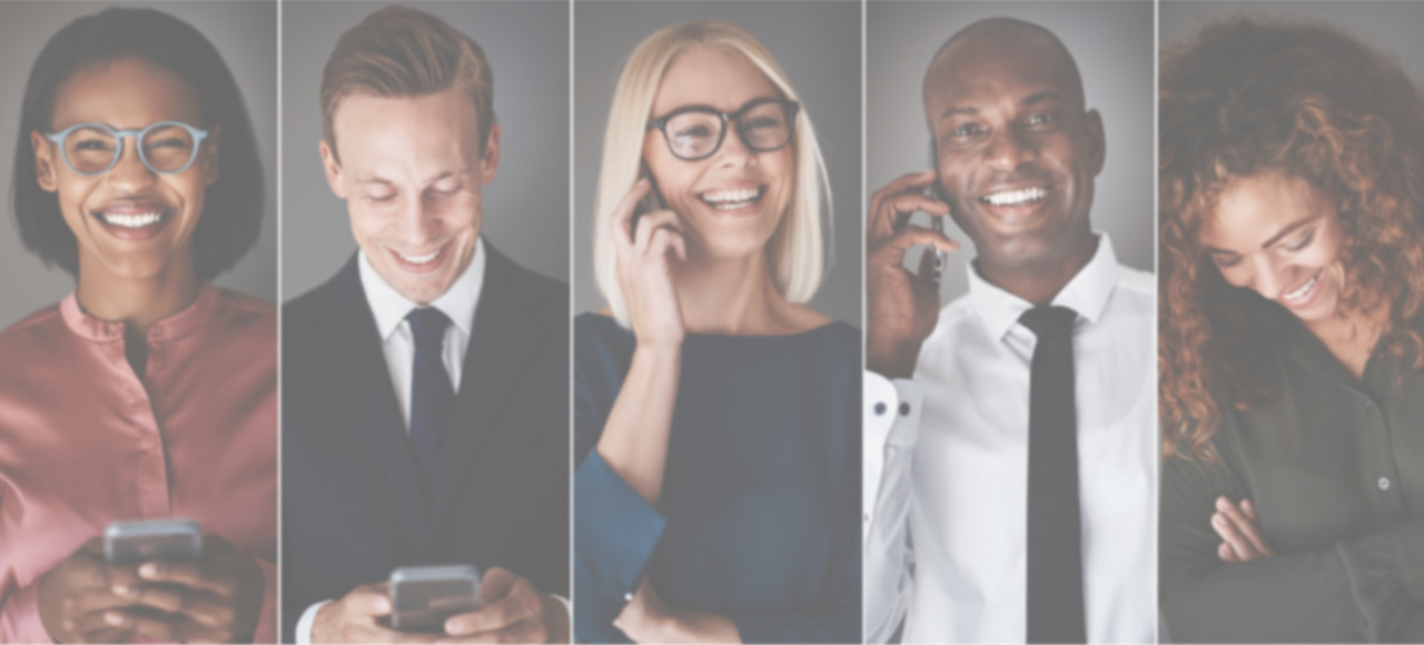 A group of diverse individuals smiling while on phones