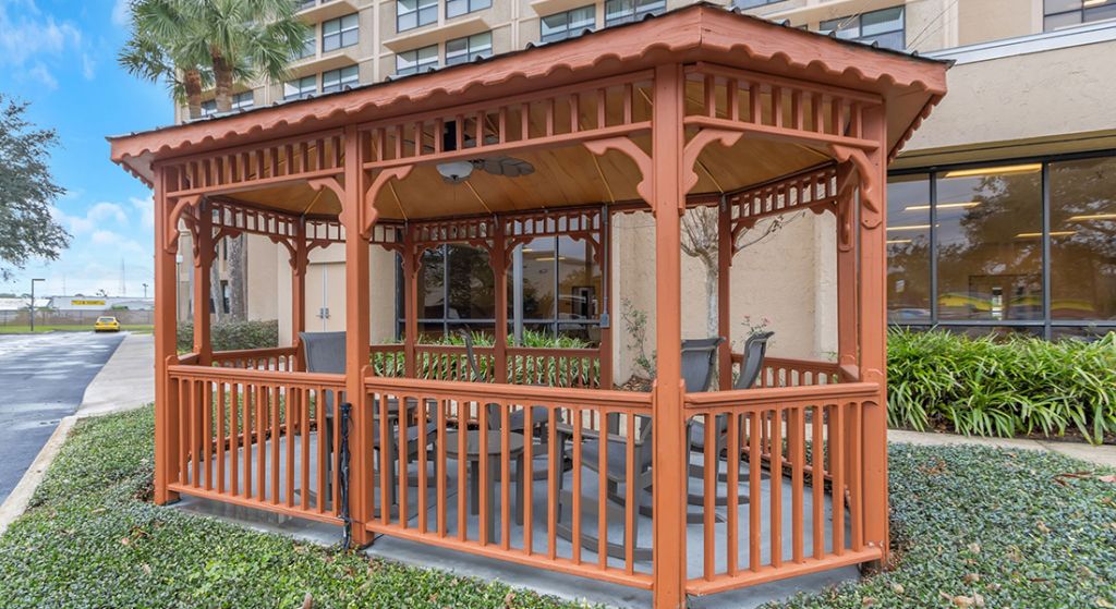 Outdoor gazebo with seating area in a garden