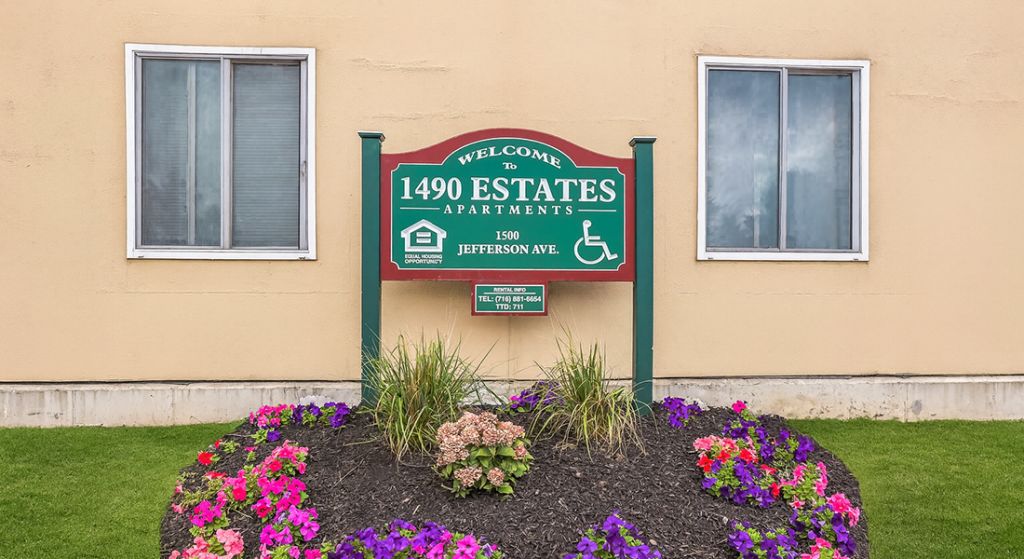 Exterior sign for 1490 Estates Apartments.