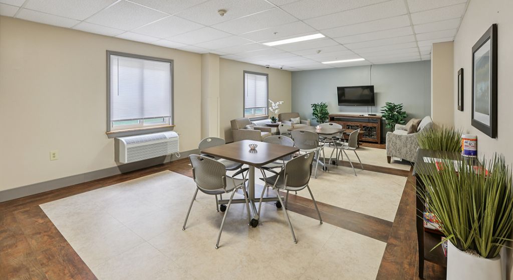 Bright common area with tables and seating