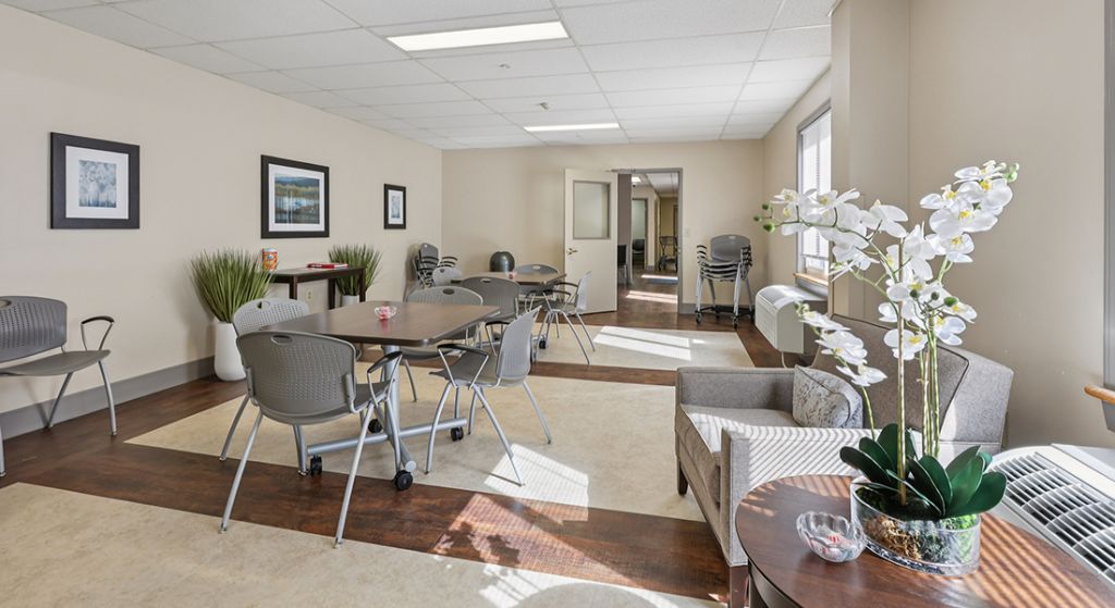 Bright common area with tables and chairs