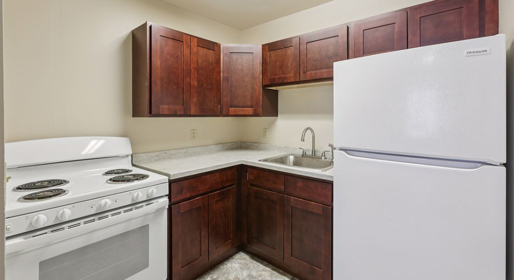 Kitchen area with cabinets and appliances