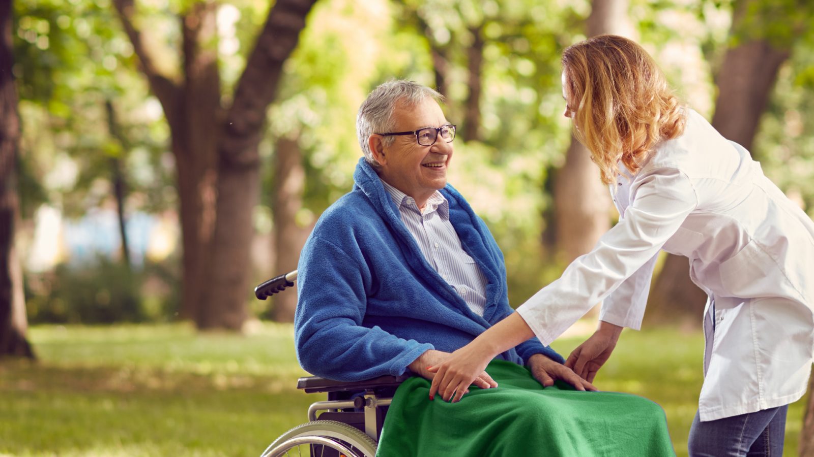 Staff member interacting with a resident outdoors
