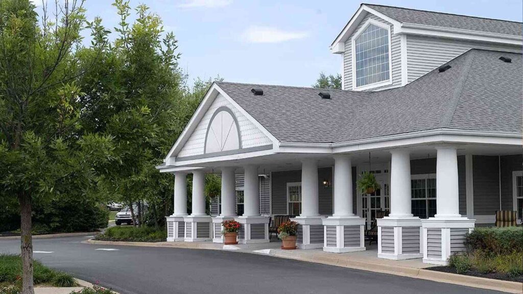 Front entrance of a senior living facility with columns