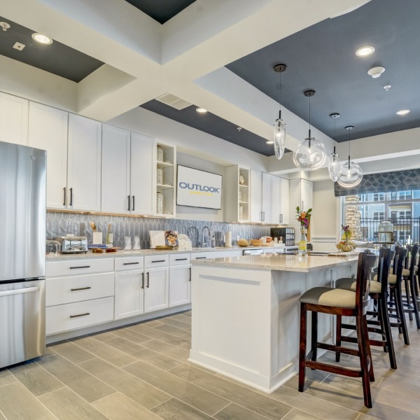 Bright kitchen area with seating and dining space