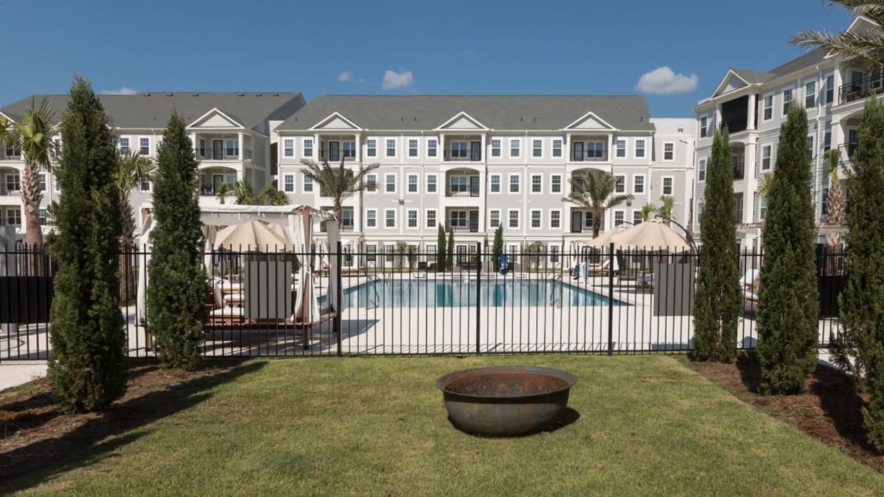 A view of the outdoor pool area with cabanas