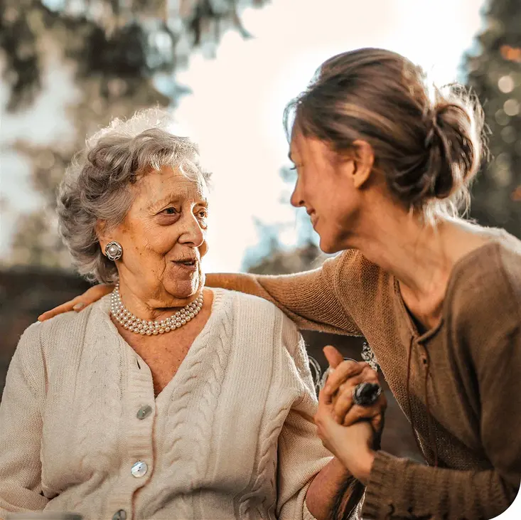 Elderly woman enjoying time with caregiver