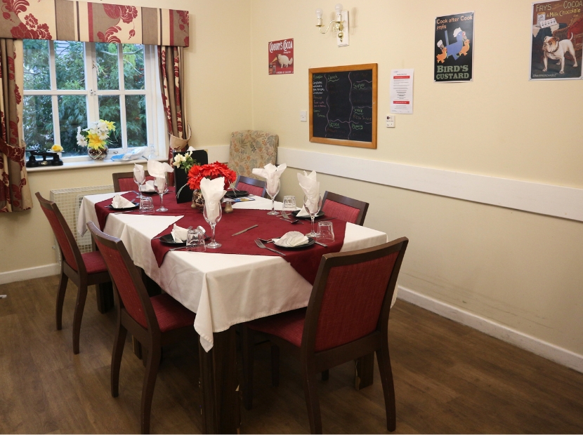 Dining table set for a meal in a common area