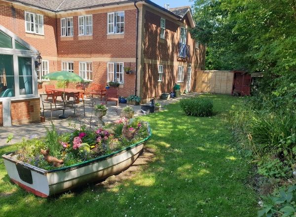 Outdoor garden area with flowers and seating