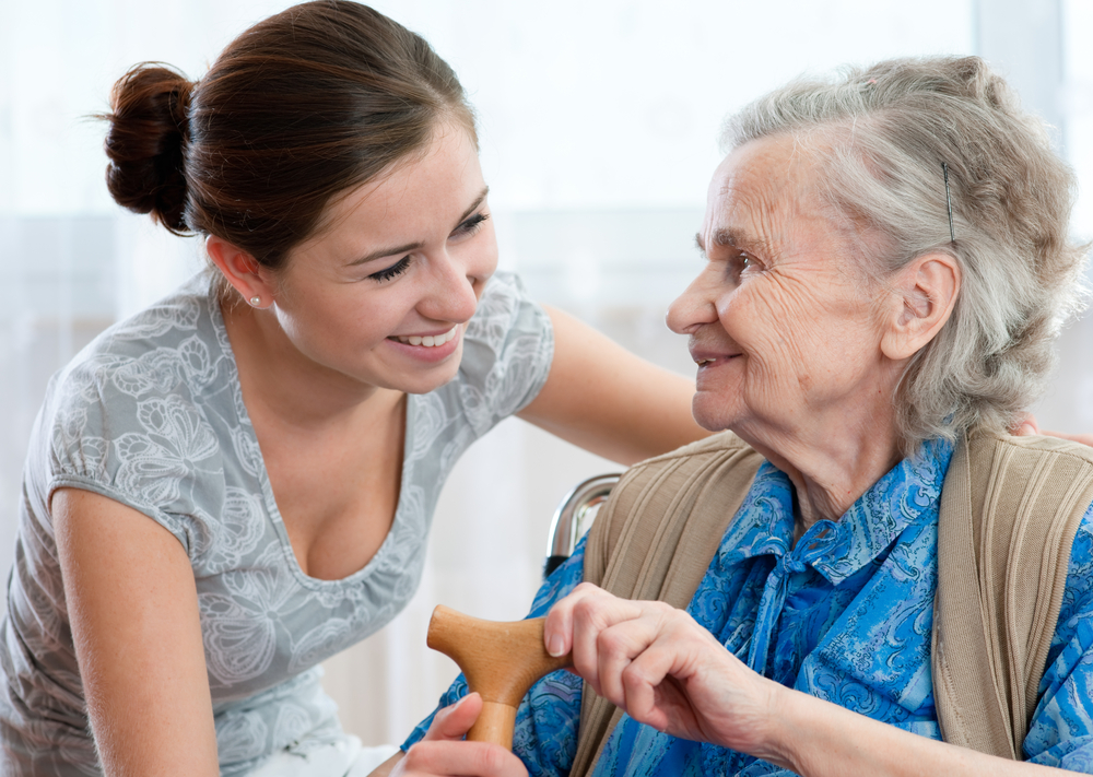 Caregiver interacting with an elderly woman