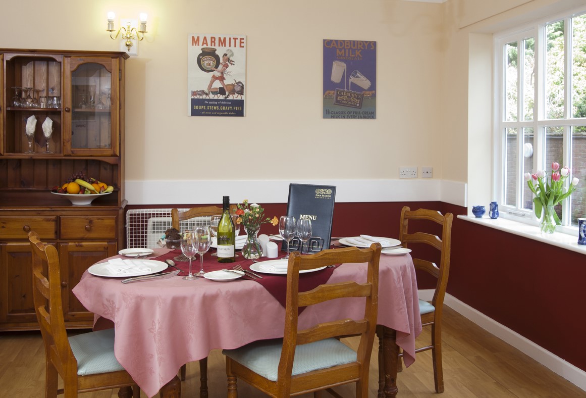 Dining table set for a meal in a homey setting.
