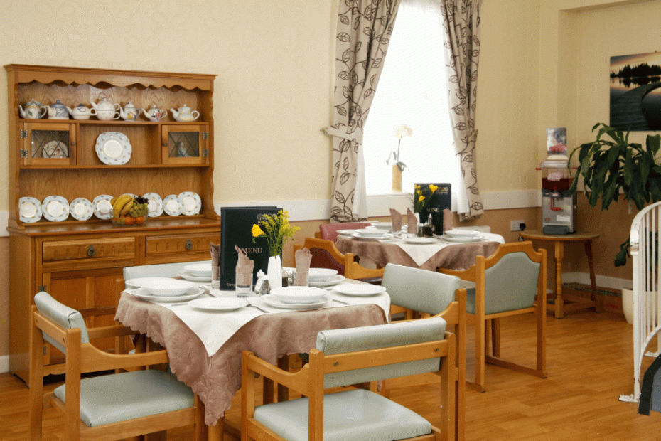 Well-set dining area with elegant table settings.