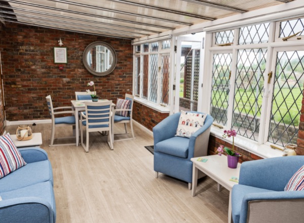 Bright common area with seating and natural light.