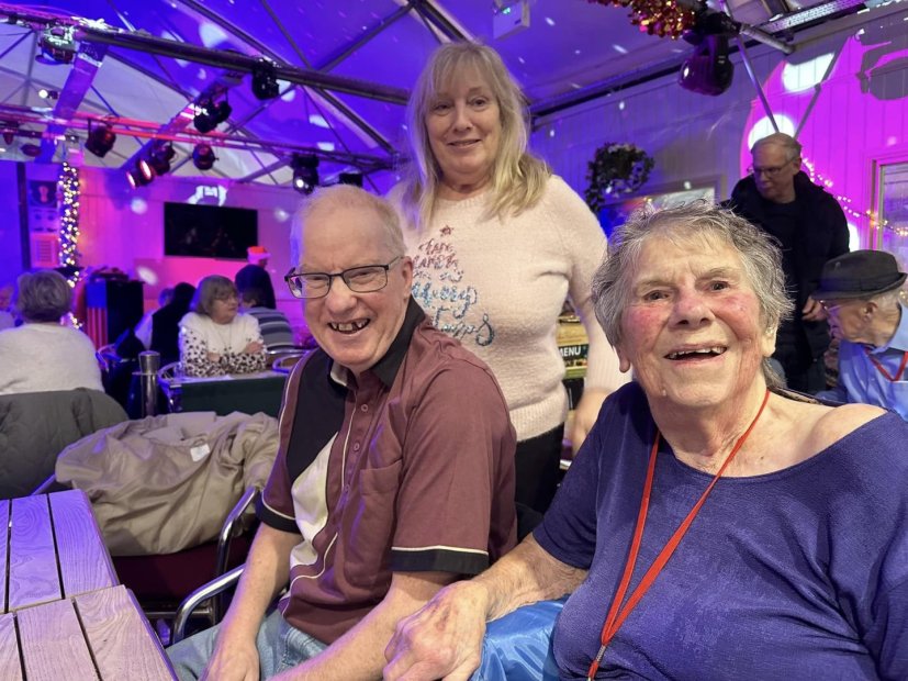 Residents and staff enjoying time together in a communal area.