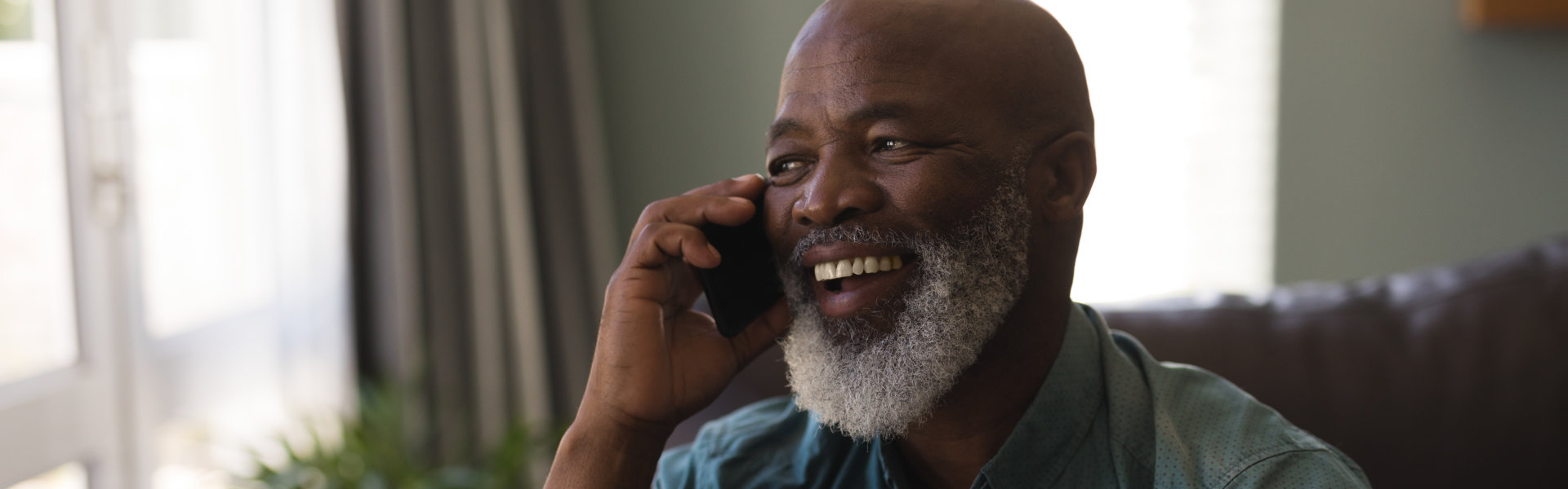 Senior man smiling on the phone