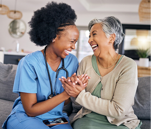 Nurse and resident sharing a joyful moment