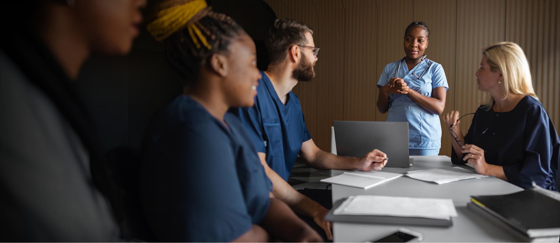 Healthcare professionals engaged in a meeting