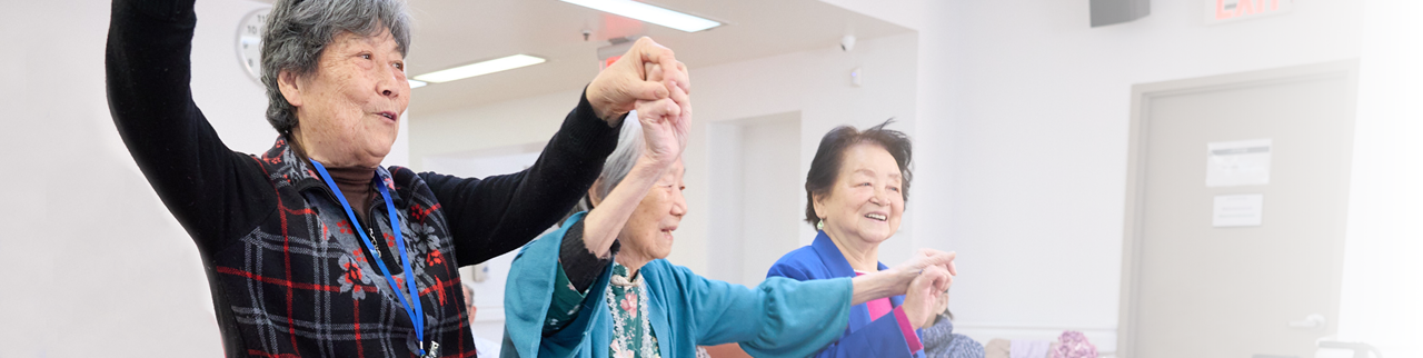 Seniors participating in a group exercise activity