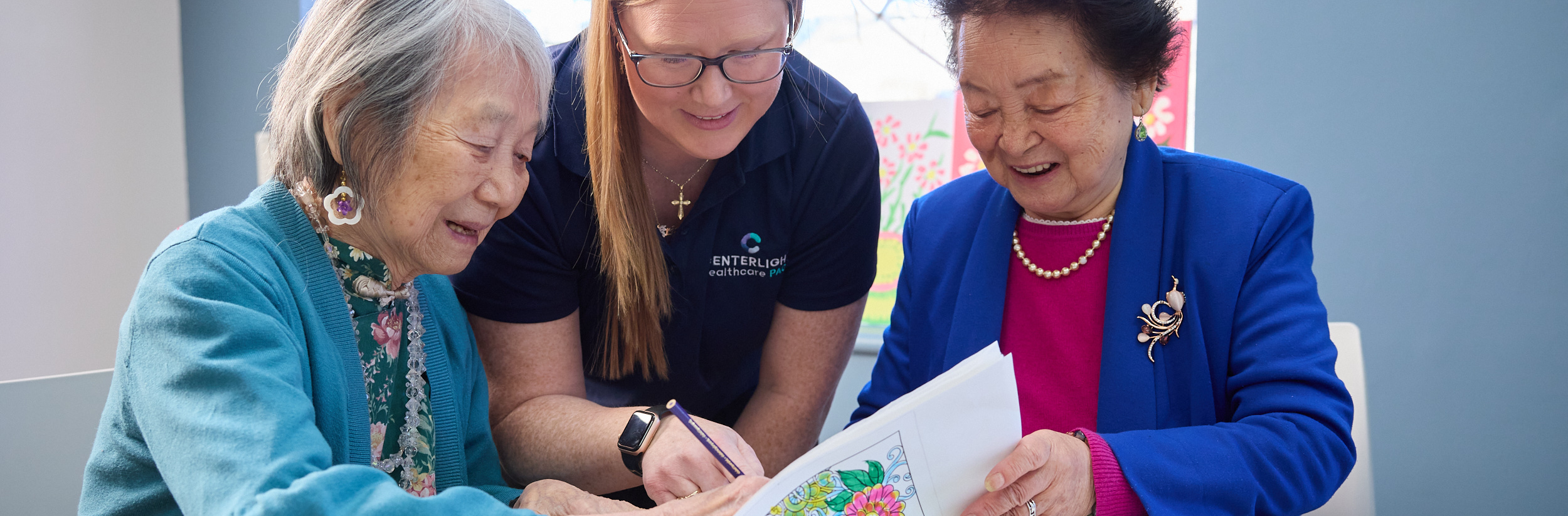 Residents and staff engaged in a creative activity