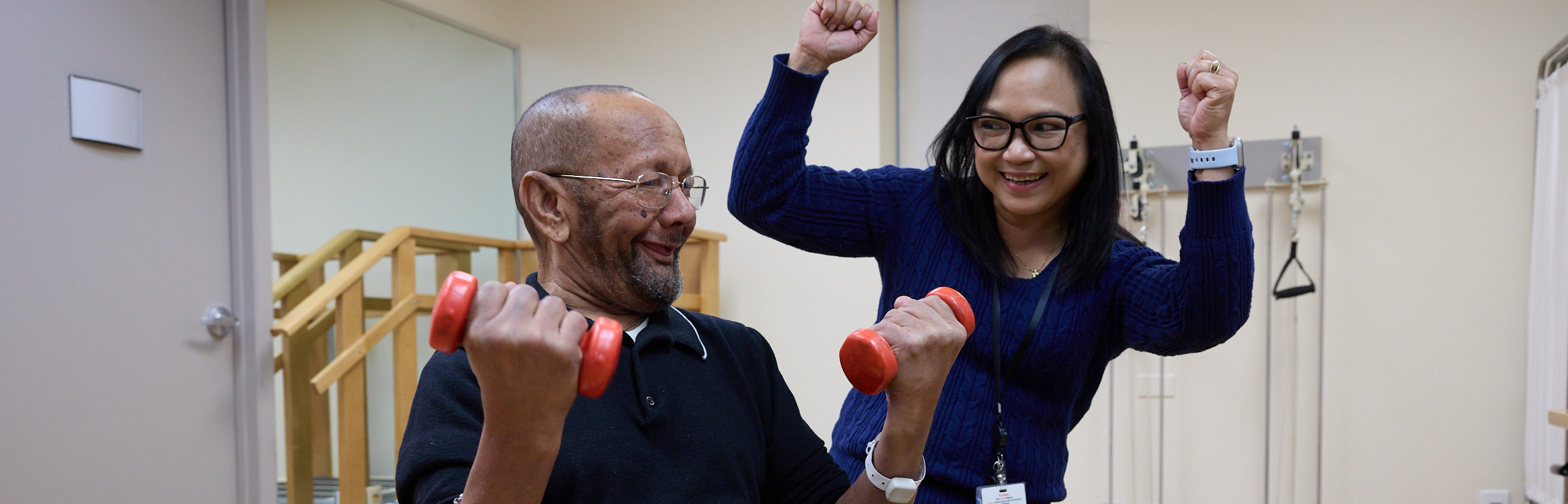 Resident exercising with staff support