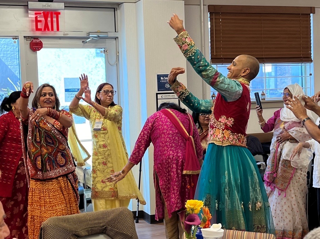 Residents participating in a cultural dance event.