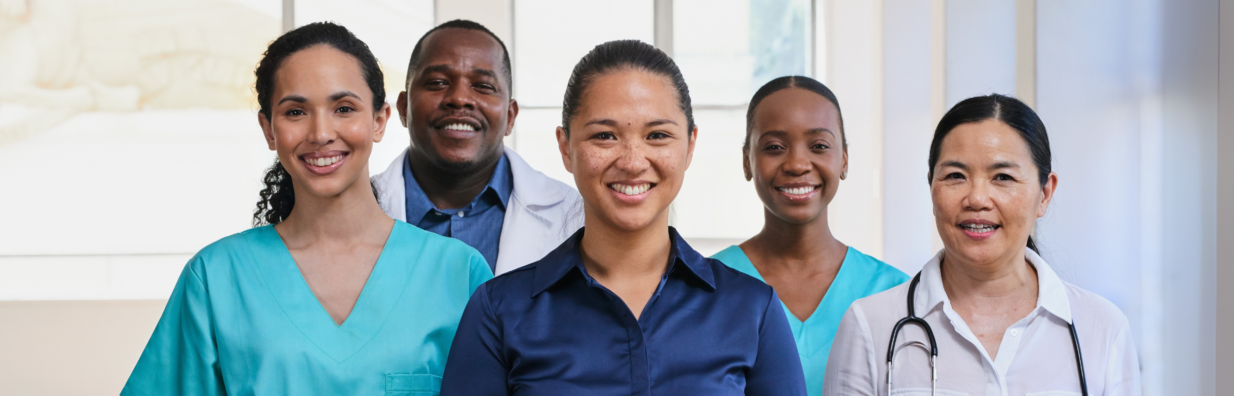 Diverse healthcare staff smiling together