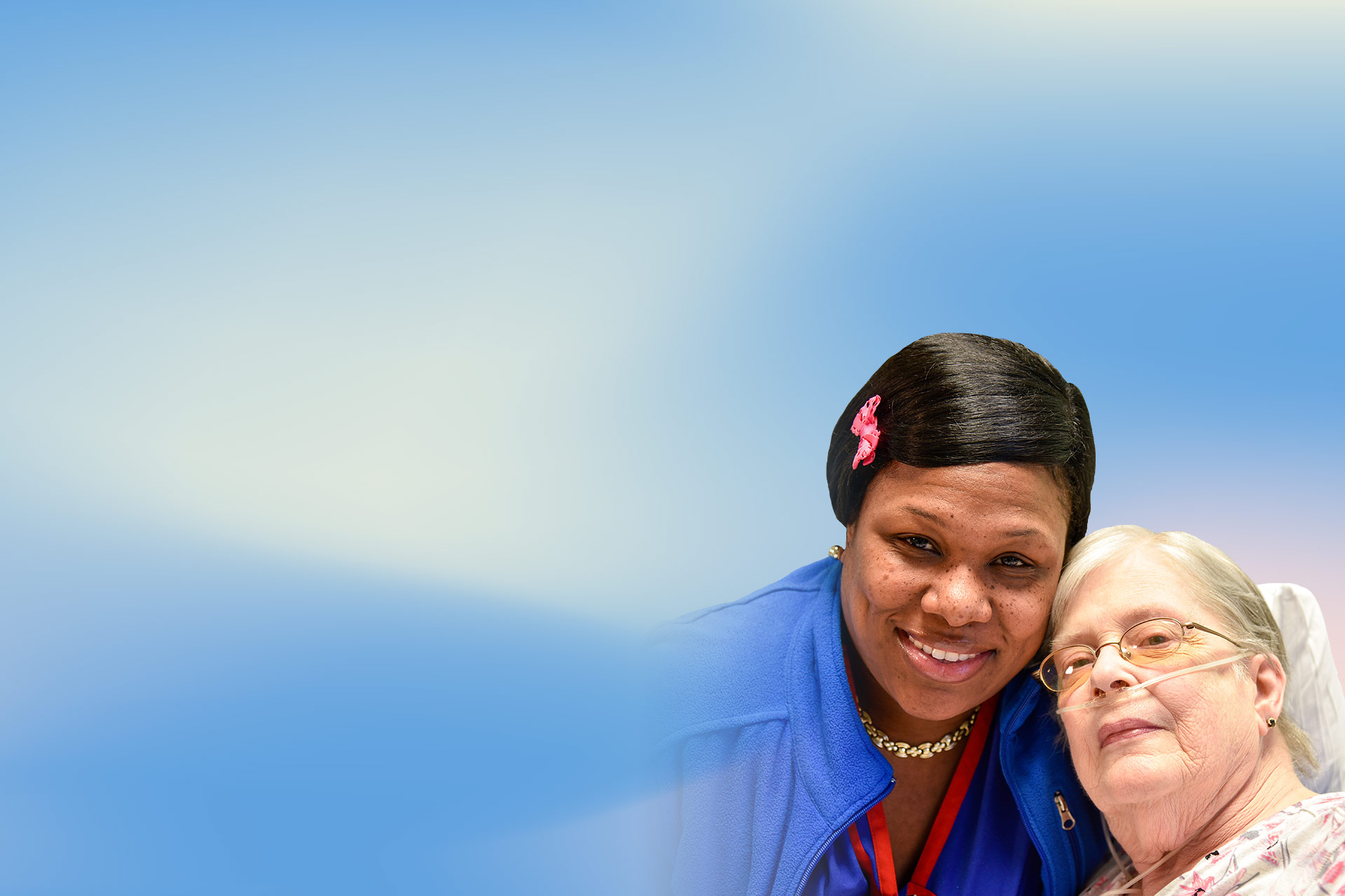 Caregiver with a resident smiling together.