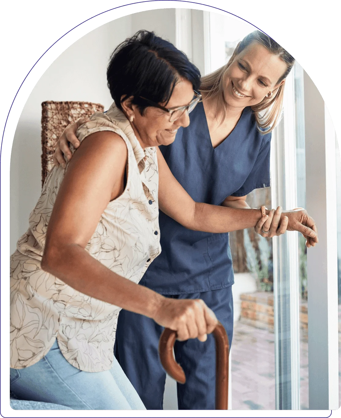 Caregiver assisting a resident indoors.
