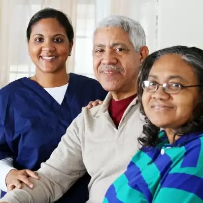 Smiling staff and residents in a welcoming environment.