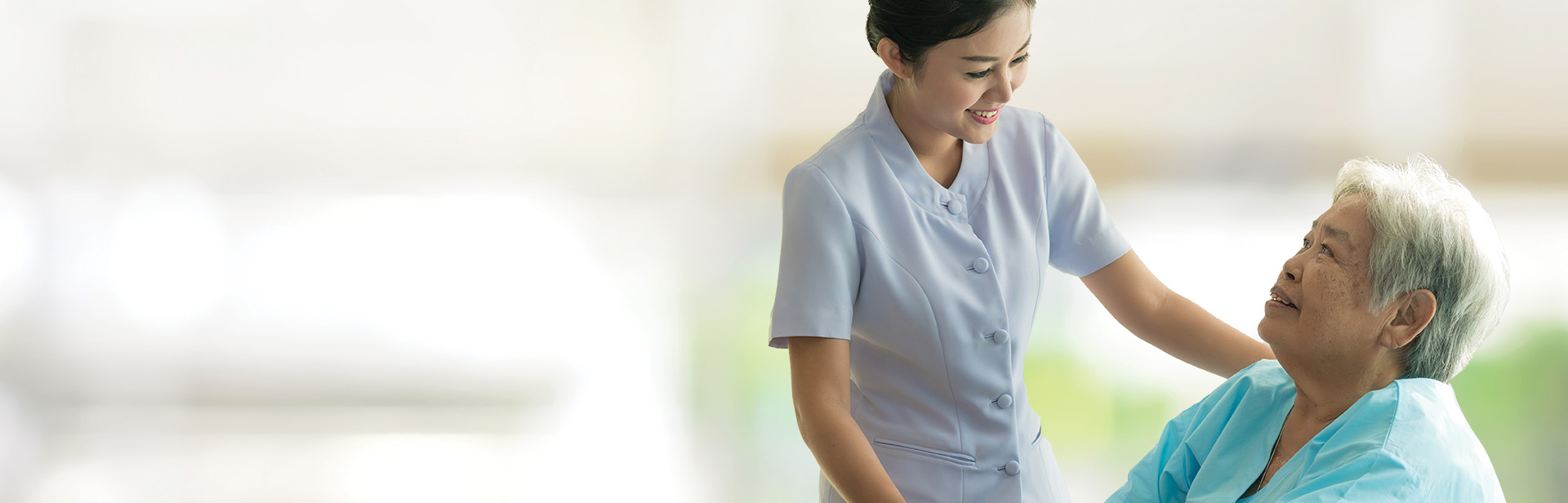 Caregiver interacting with a senior resident