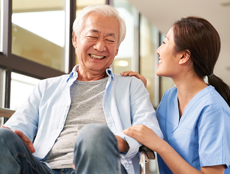 Senior resident enjoying time with a caregiver.