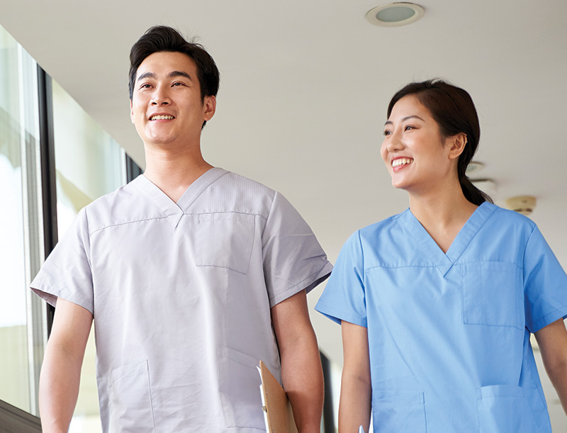 Two staff members walking in the facility