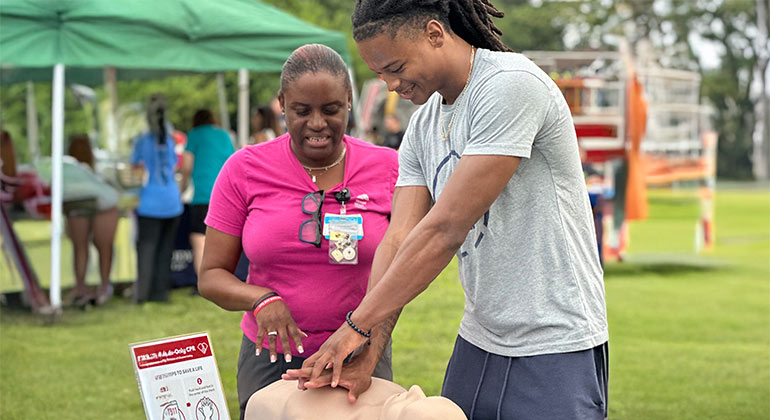 Residents and staff engaged in a CPR training session.