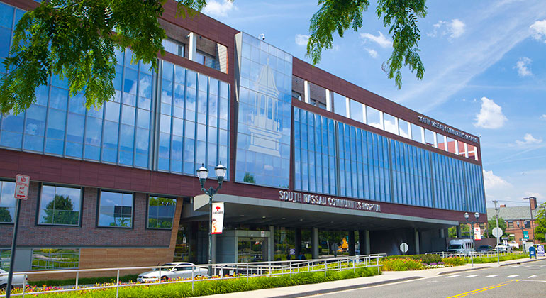 Exterior view of South Nassau Community Hospital building.