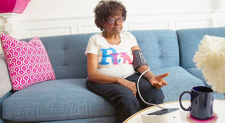 Senior woman taking her blood pressure