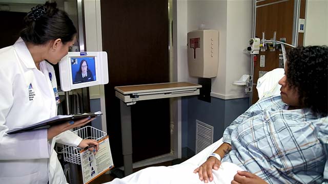 Healthcare professional consulting with patient via telehealth