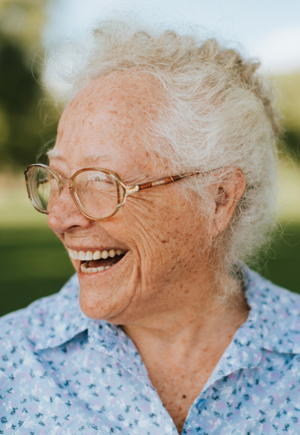 Smiling senior woman outdoors.