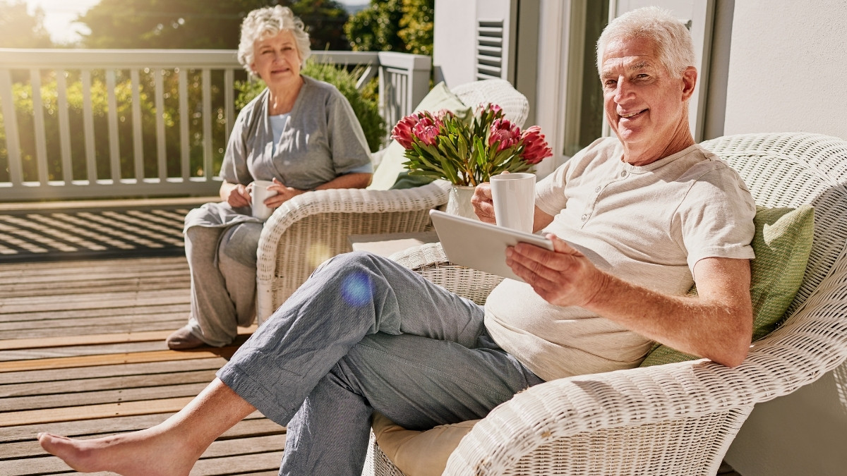 Couple enjoying flowers on a porch