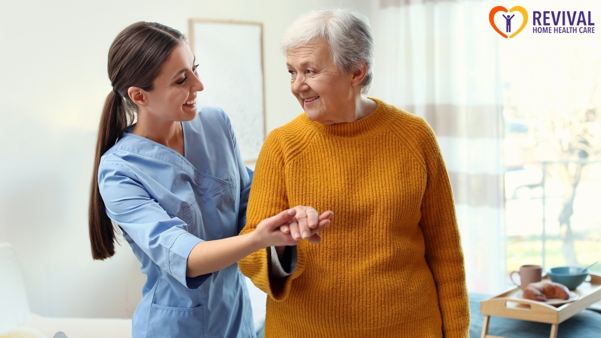Caregiver assisting an elderly woman indoors