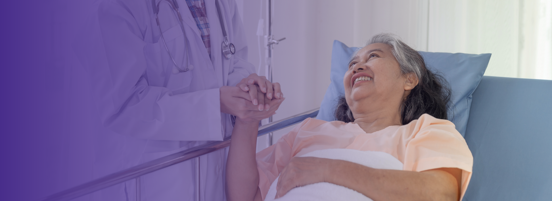 Patient in hospital bed interacting with a doctor.